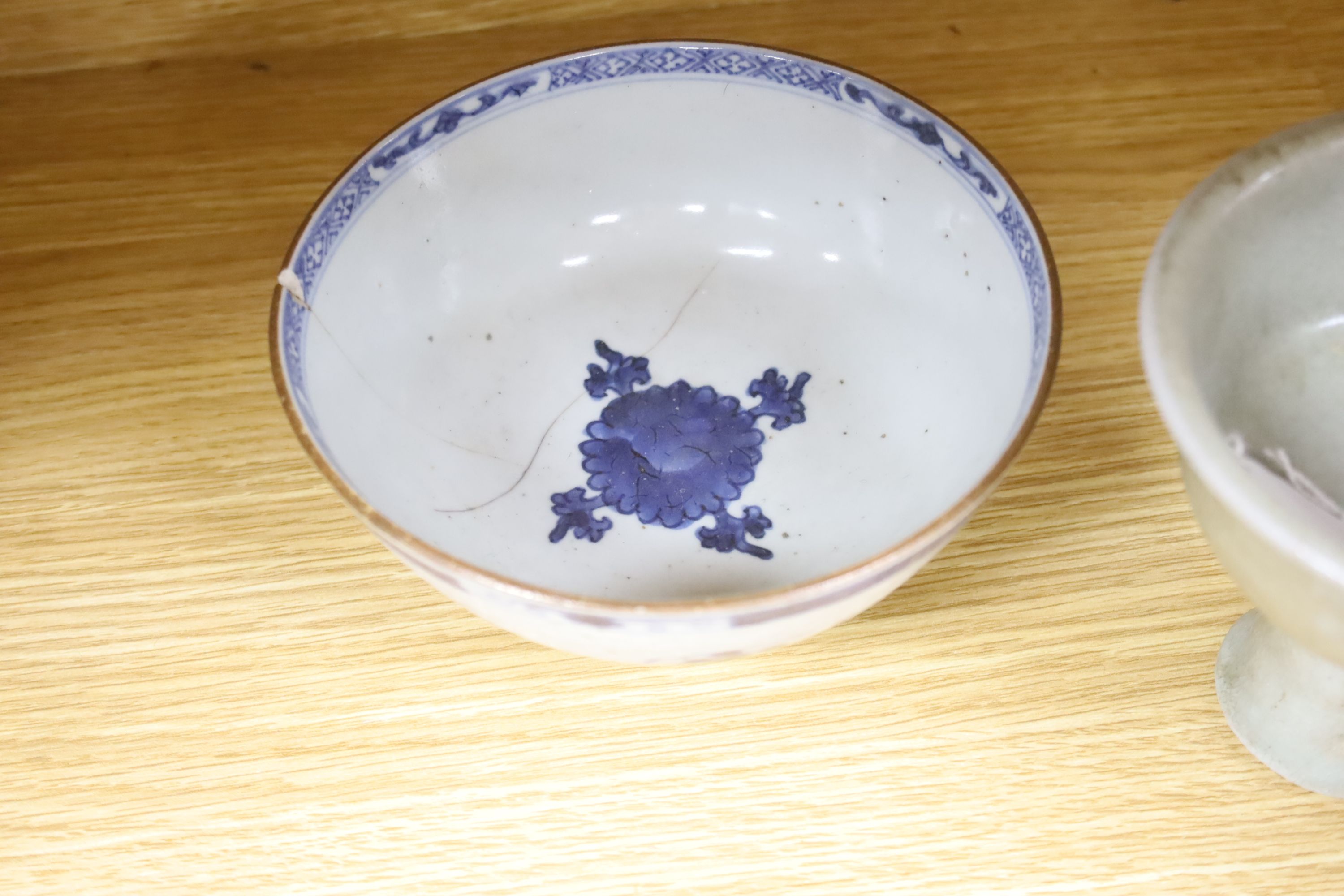 A Chinese blue and white bowl, diameter 15cm, a tea bowl and saucer, a crackleglaze shell dish and a celadon glazed stem cup